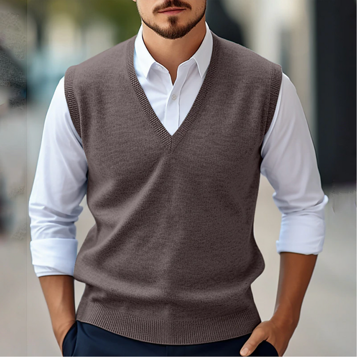 Sophisticated men's V-neck sleeveless sweater vest in a tailored fit, suitable for smart casual and business fashion.