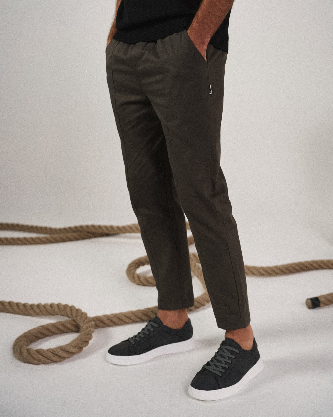 Man wearing Valencia tapered joggers, demonstrating flexibility and style for athletic activities.