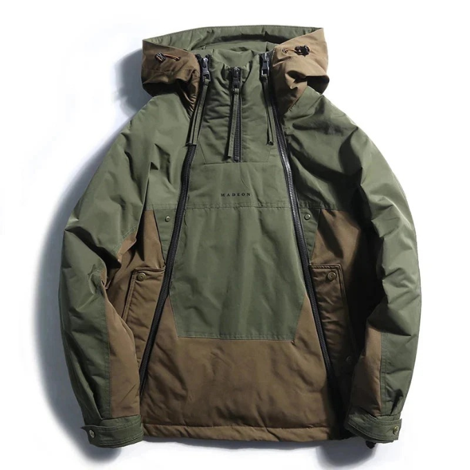 Close-up of utility pockets & waterproof zippers on a Men's Vector techwear winter coat.