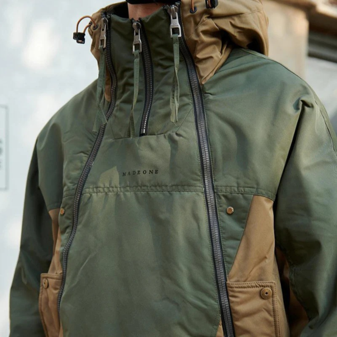 Detailed fabric of the Men's Vector insulated techwear jacket, showcasing warmth & durability.