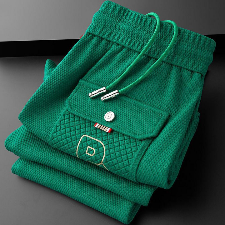 Comfortable men's Vellaros athletic pants with a modern tapered fit, suitable for daily casual wear.