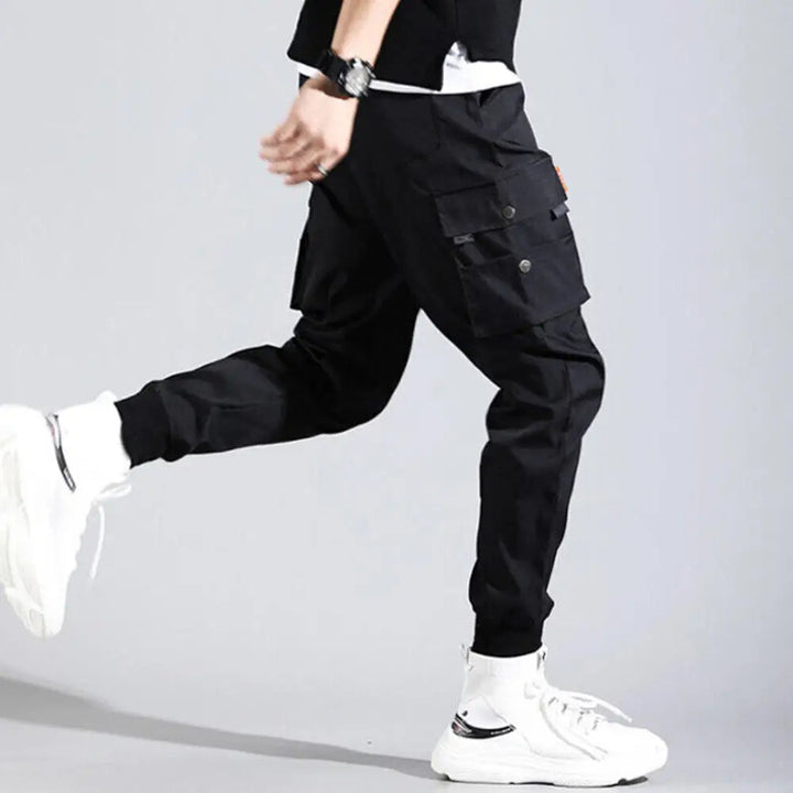 Stylish men's cargo joggers featuring an athletic fit, multiple pockets, and elastic cuffs for versatile wear.