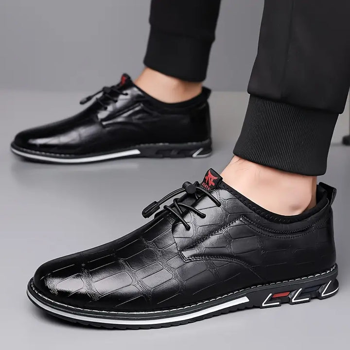 Polished men's slip-on dress sneakers, versatile for casual or business casual looks.