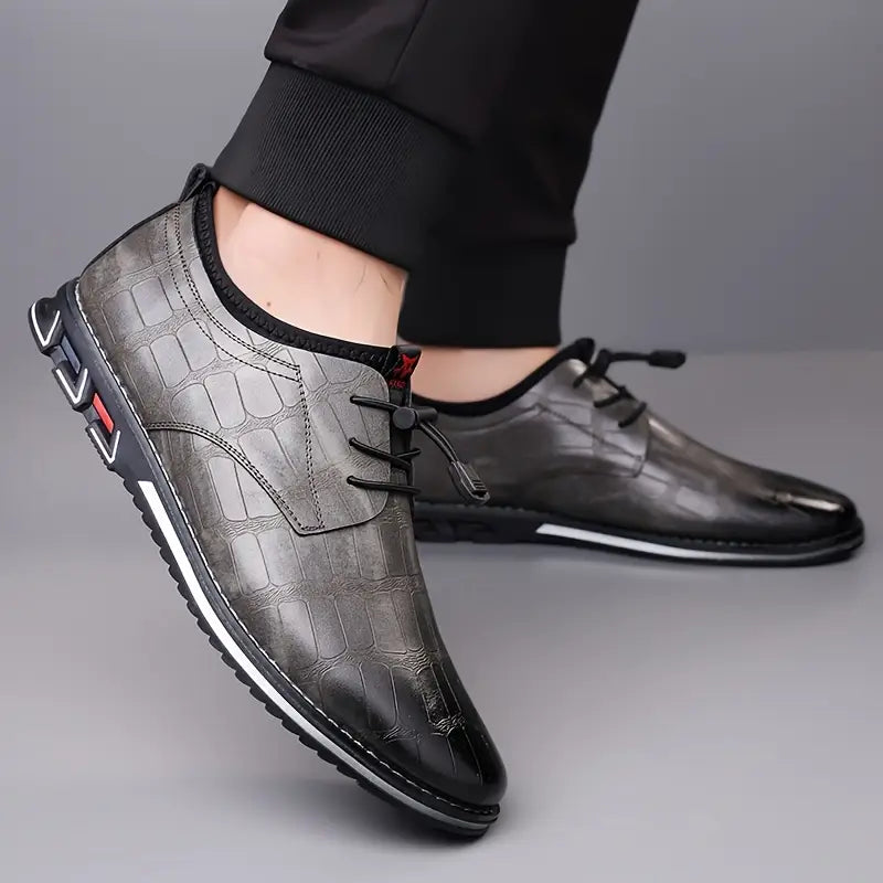 Versatile men's slip-on sneakers, combining active comfort with a sophisticated dress shoe aesthetic.