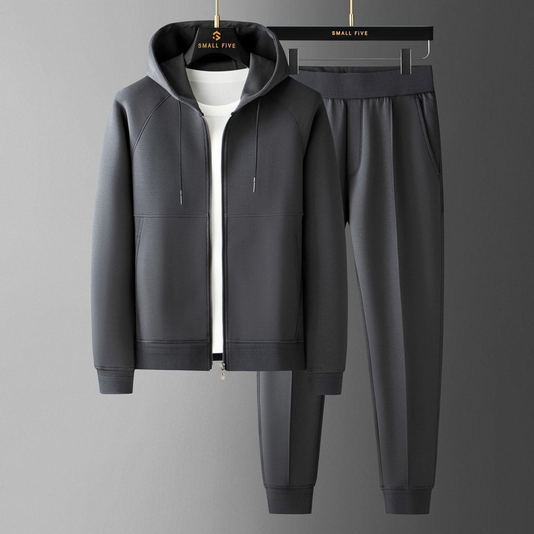 Man relaxing in Verona Elite tracksuit, a comfortable two-piece set for casual wear & loungewear.