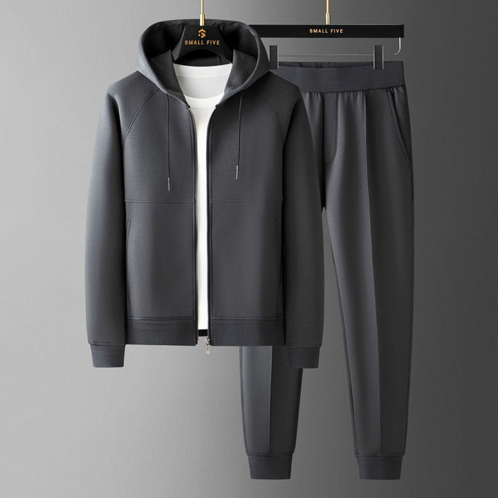 Man relaxing in Verona Elite tracksuit, a comfortable two-piece set for casual wear & loungewear.