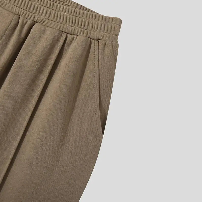 Smart casual look featuring Khaki Verona Pleated Dress Trousers, perfect for various settings.