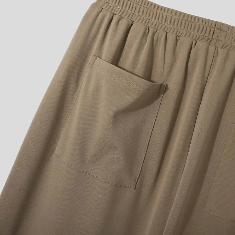 Back view of Verona Pleated Dress Trousers for men, showing tailored fit and functional pockets.