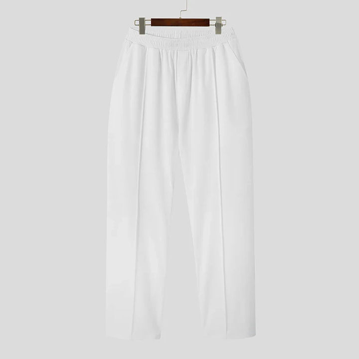 Detail shot of Verona Pleated Dress Trousers for men, highlighting the crisp pleats and quality fabric.