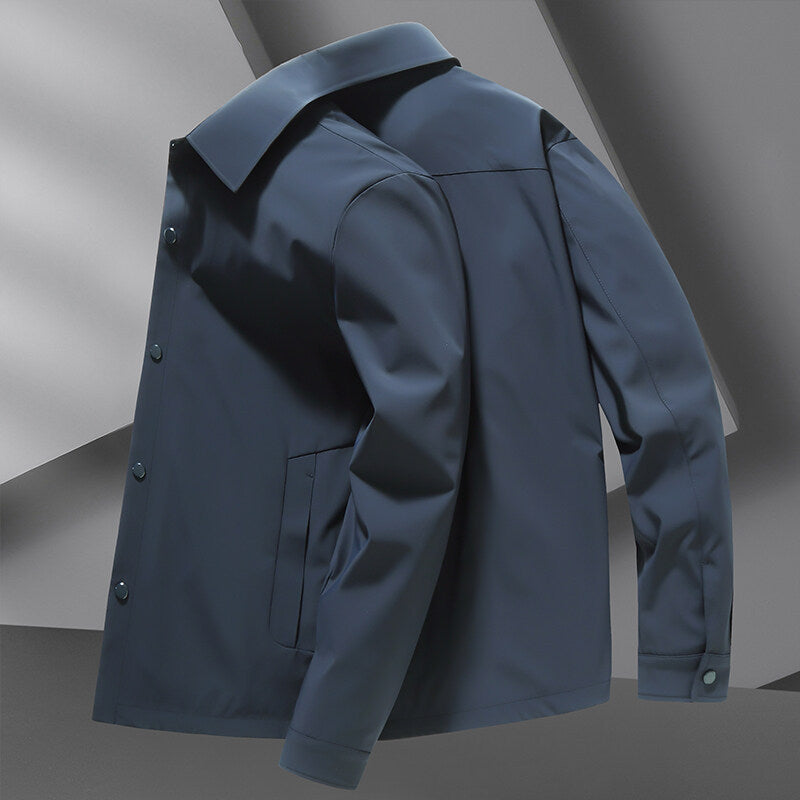 Versatile men's all-season snap jacket. Lightweight, water repellent, and perfect casual outerwear for any weather.