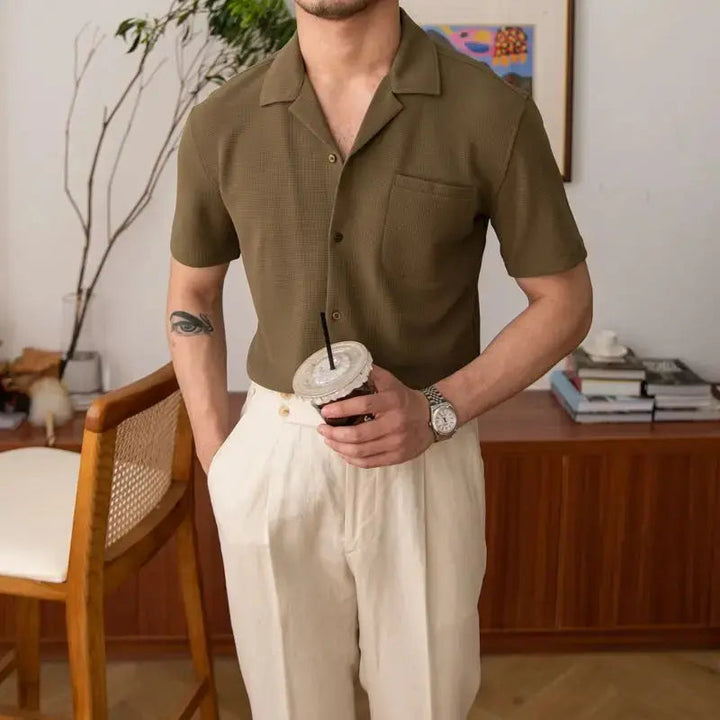 Khaki men's short sleeve collared button-up shirt, a classic choice for summer and casual fashion.