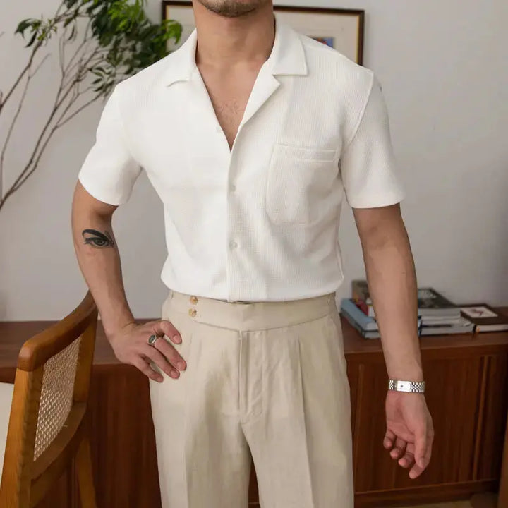 Classic black men's basic button-up shirt, highly versatile for formal, casual, and everyday style.