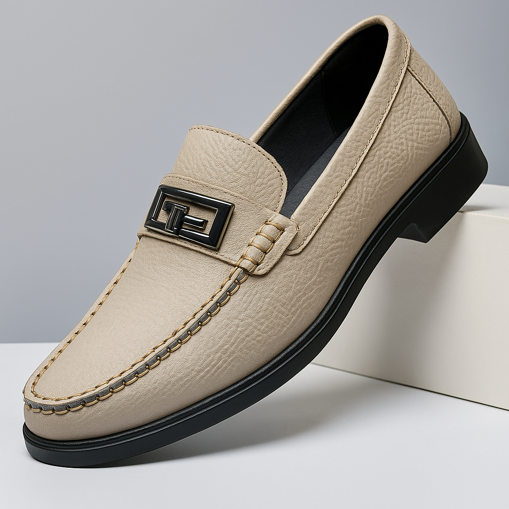 Men's versatile black slip-on loafers with elegant silver buckle, perfect for formal or casual outfits.