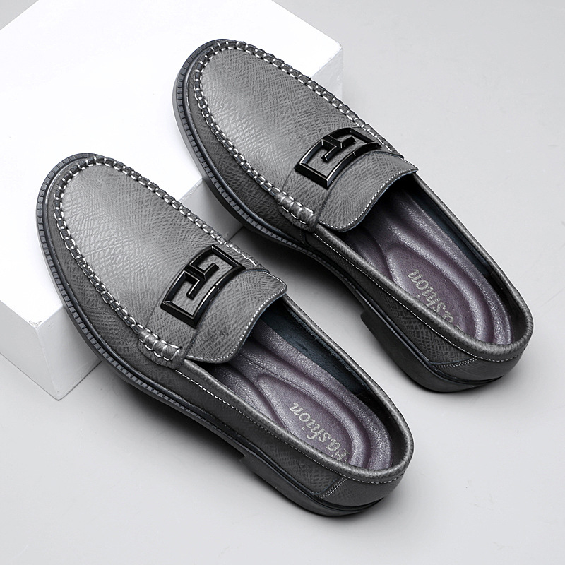 Modern men's slip-on dress shoes, brown, with a sleek buckle accent for a sharp appearance.