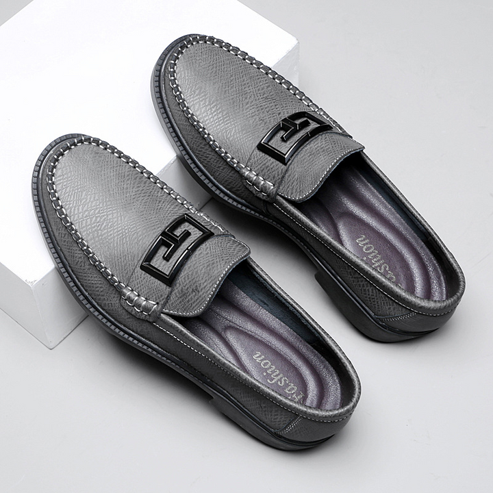 Modern men's slip-on dress shoes, brown, with a sleek buckle accent for a sharp appearance.