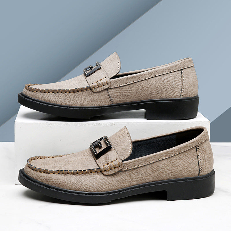Classic men's brown slip-on loafers featuring a stylish buckle accent and comfortable design.