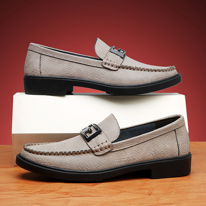 Stylish men's dress loafers, easy slip-on style, with a decorative buckle for a refined look.