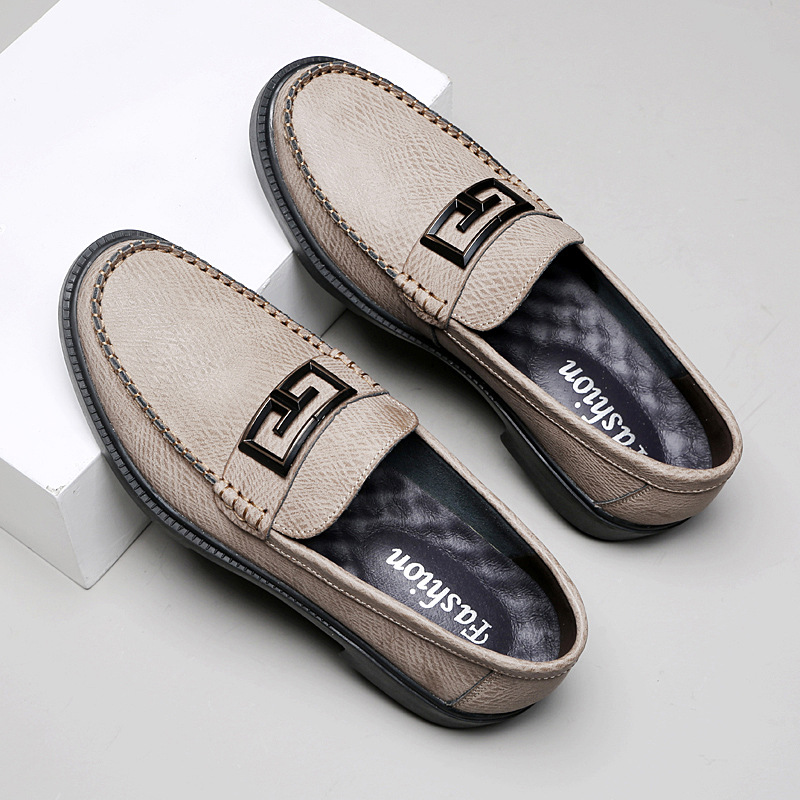 Brown leather men's slip-on loafers, versatile footwear with a polished buckle detail.