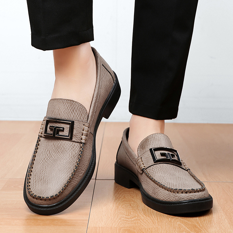 High-quality men's slip-on shoes, black, with a unique buckle, suitable for office and events.
