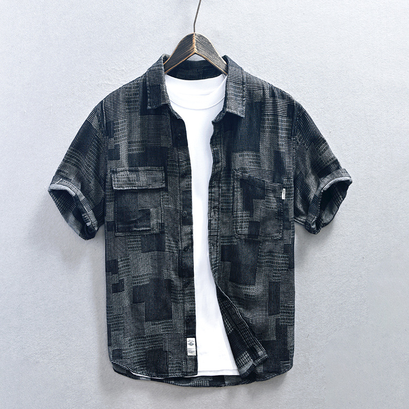 Casual men's blue denim shirt featuring a relaxed fit & button-down style, great for everyday summer fashion.