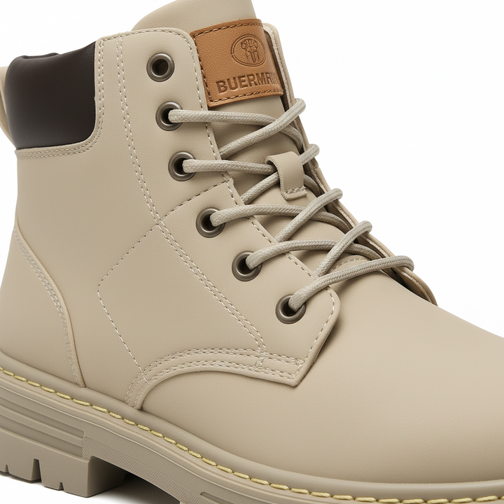 Close-up of men's Aaron ankle boots showing synthetic leather texture, stitching, and comfortable padded top.
