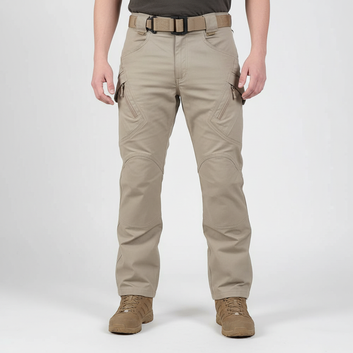 Model wearing men's durable cargo trousers, Gabriel, outdoor fashion, side view