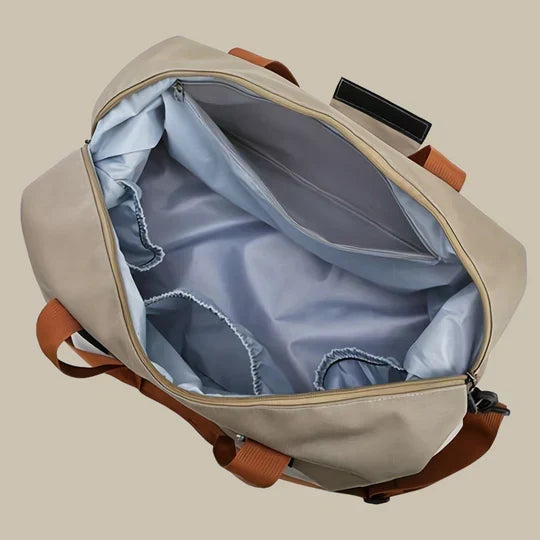 Compact men's carry-on duffle bag with a smart shoe compartment. Ideal for short travels & gym visits.