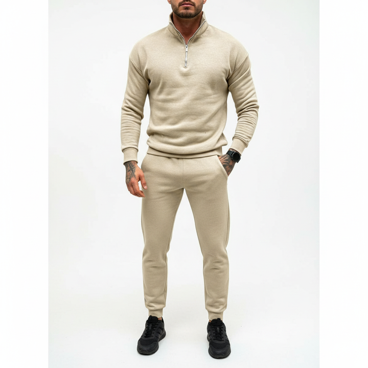 Folded blue men's half-zip cotton blend sweater, ready for casual or smart-casual wear