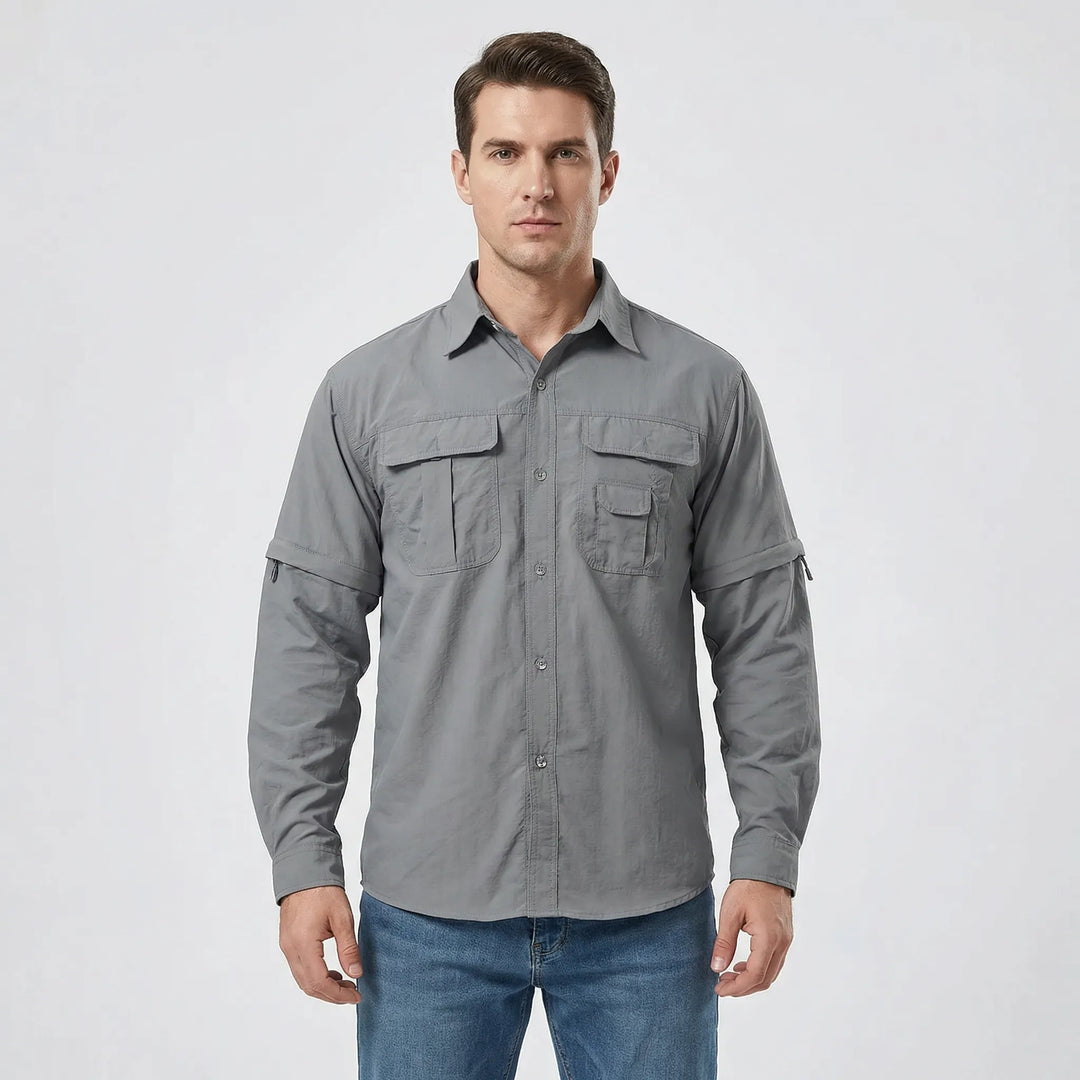 Stylish men's travel shirt, with zip-off sleeves for adaptability in varying climates and outdoor activities.