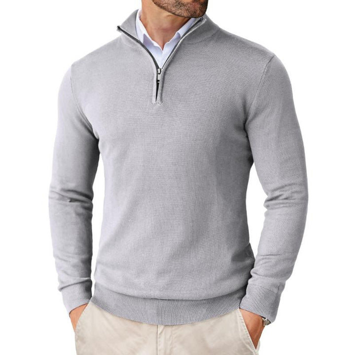 Cozy men's cotton merino quarter zip knit pullover, perfect for layering in winter fashion.
