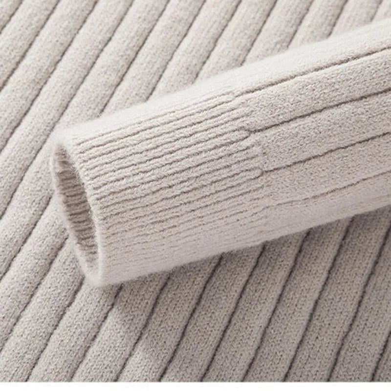 Sophisticated men's ribbed half-zip sweater, a key layering piece for contemporary wardrobes.