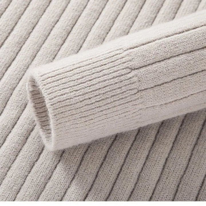Sophisticated men's ribbed half-zip sweater, a key layering piece for contemporary wardrobes.