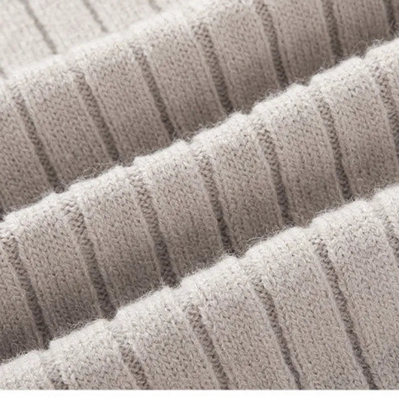 Stylish men's neutral-toned ribbed half-zip sweater, blending comfort with a versatile, modern design.