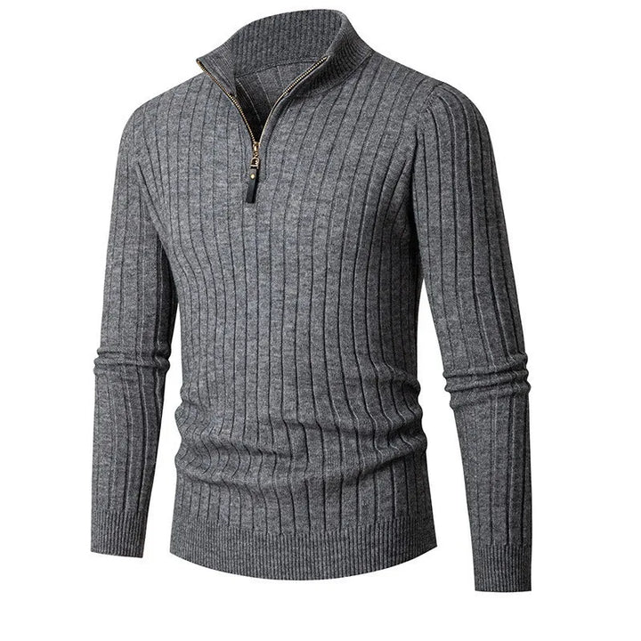Close-up of a men's ribbed half-zip sweater, highlighting its unique texture and modern fit.