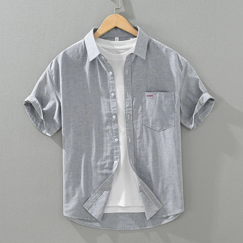 Men's short sleeve button-up shirt in a relaxed fit. A versatile summer top for casual, everyday warm weather comfort.