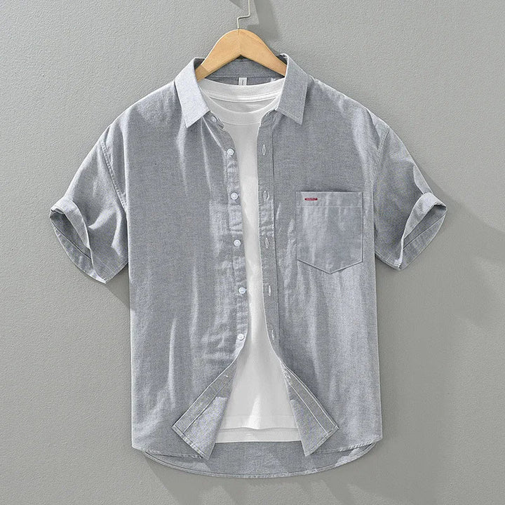 Men's short sleeve button-up shirt in a relaxed fit. A versatile summer top for casual, everyday warm weather comfort.