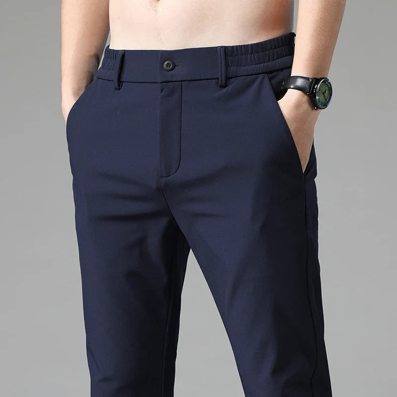 Close-up of stretchy, wrinkle-resistant fabric on men's versatile straight fit dress pants.