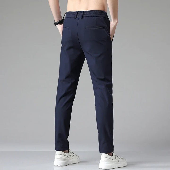 Back view of men's straight fit pants, showing classic design & comfortable, versatile everyday wear.