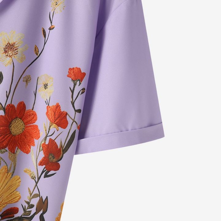 Fashion-forward men's vibrant floral button-up shirt. Comfortable short-sleeve for stylish comfort.