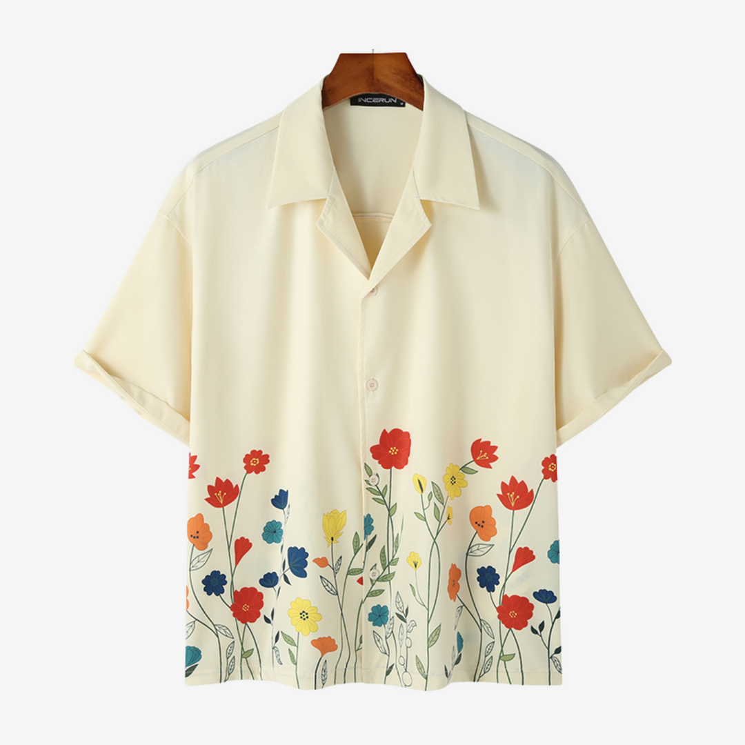 Trendy men's shirt with a vibrant floral print. Perfect short-sleeve button-up for summer outfits.