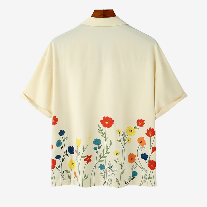 Comfortable men's vibrant floral short-sleeve button-up. A stylish statement piece for any occasion.