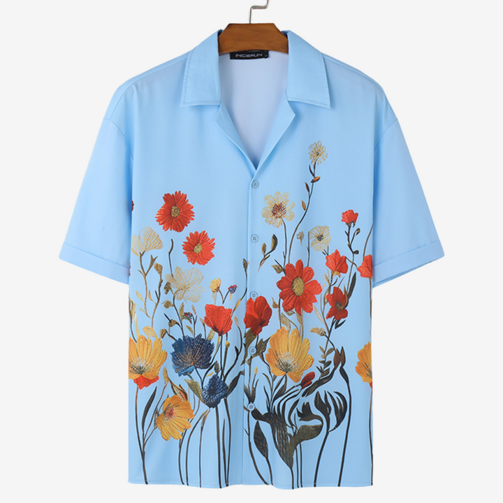 Modern men's vibrant floral button-up. Comfortable short-sleeve casual shirt for a trendy look.