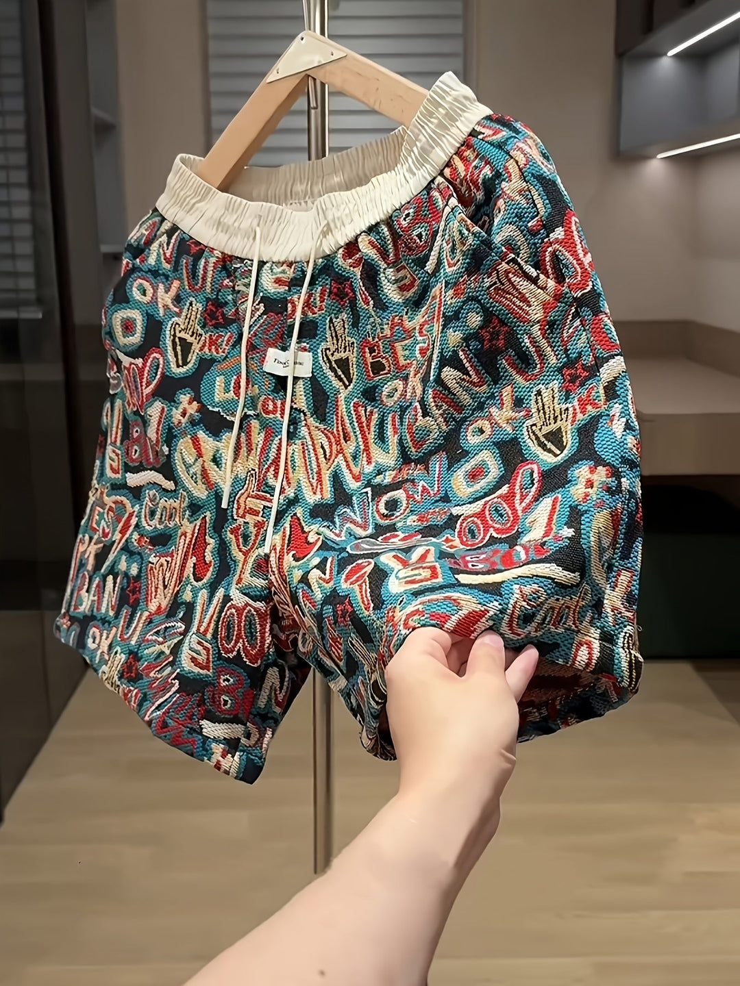 Men's vibrant graffiti print comfort shorts, ideal for urban style and streetwear. Casual, colorful graphic shorts for men.