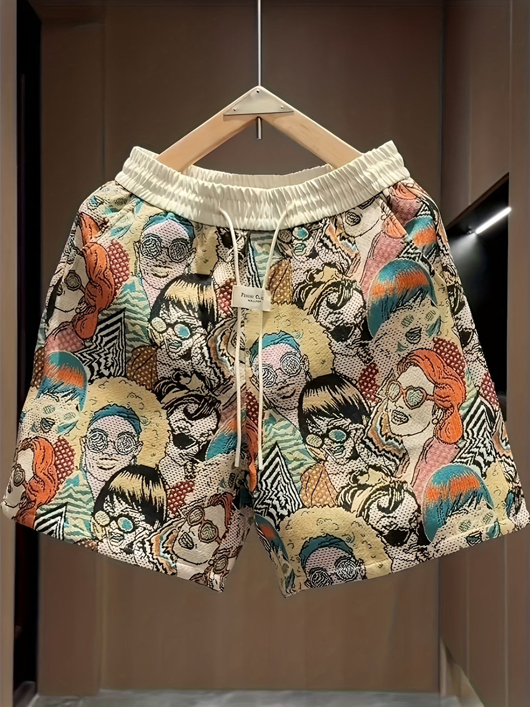 Men's vibrant retro graphic art shorts. Bold pop art print, relaxed fit for unique summer streetwear style.