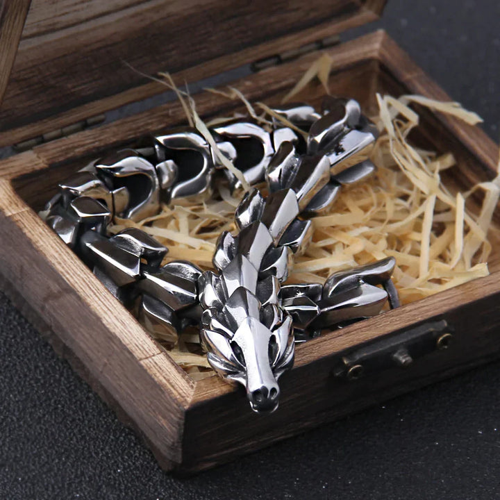 Men's antique silver Viking Hunter Bracelet on a wrist, featuring unique Nordic warrior design & stainless steel.