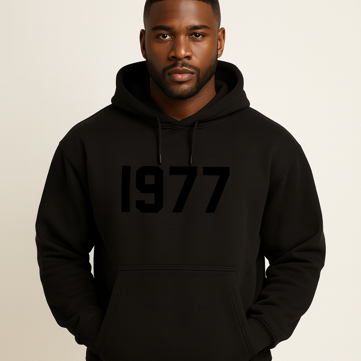 Detail shot of the 1977 print on a men's vintage "Chase" raglan sleeve streetwear hoodie.