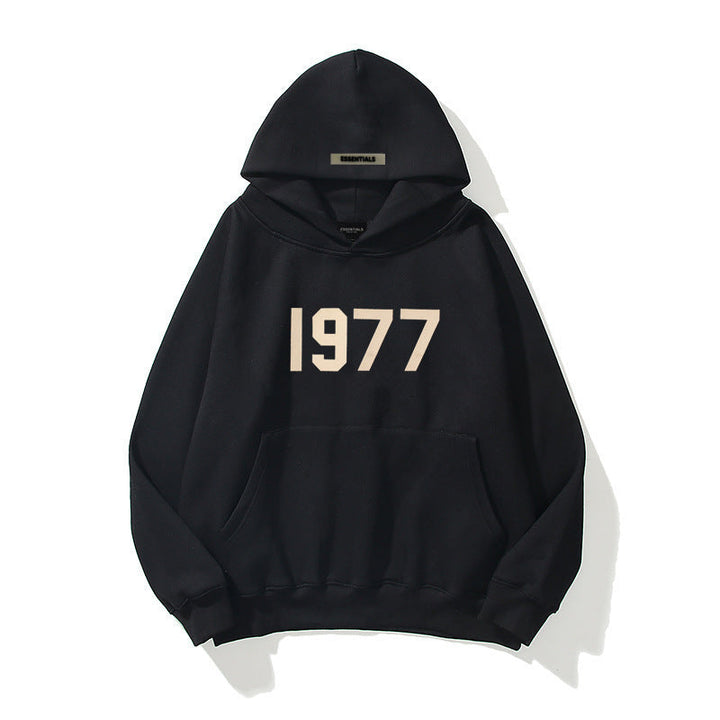Men's 1977 Streetwear Hoodie with stylish raglan sleeves. Vintage-inspired pullover for casual wear.