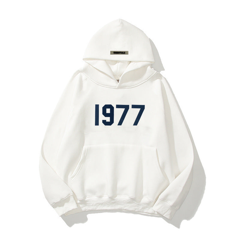 Comfortable men's raglan sleeve hoodie featuring a bold 1977 vintage streetwear print. Pullover style.