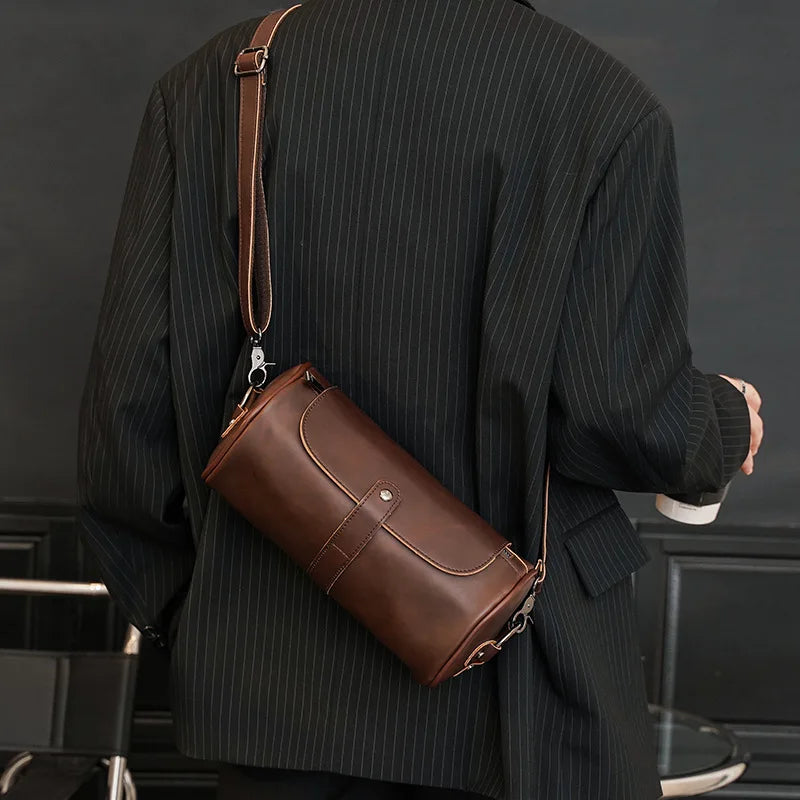 Men's vintage barrel shoulder bag in PU leather, ideal for daily essentials & men's fashion.