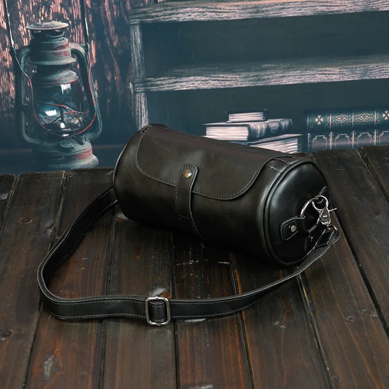 Durable men's barrel shoulder bag for daily essentials, vintage PU leather, adjustable crossbody strap.